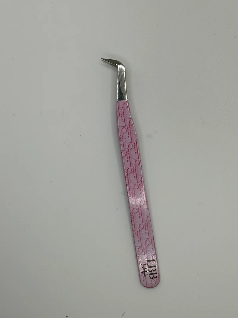 Dior pink tweezers