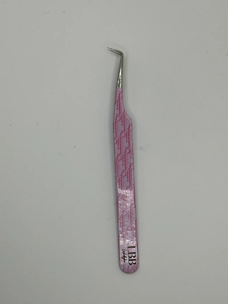 Dior pink tweezers