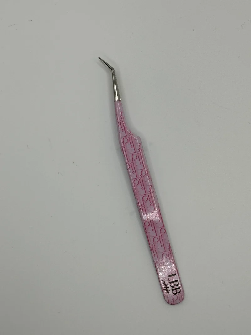 Dior pink tweezers